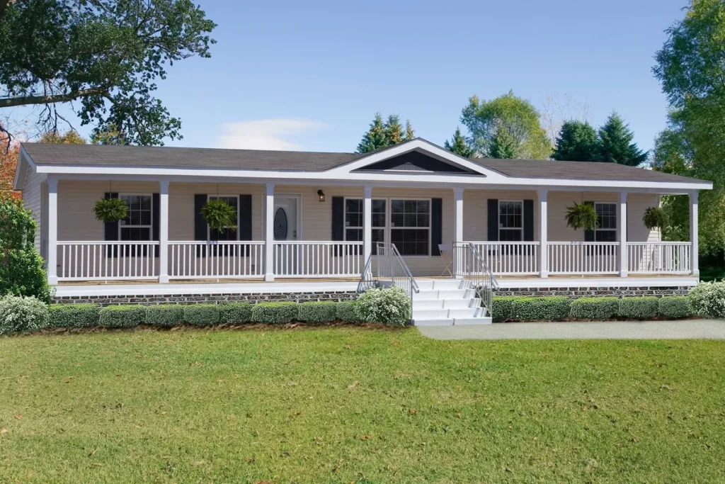White single-story house with a wooden ramp and green yard.